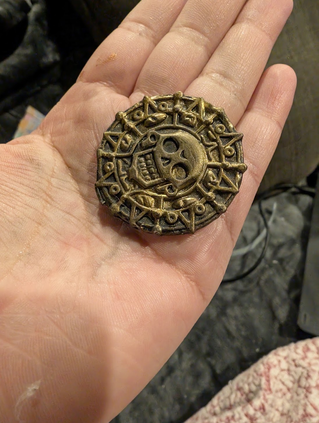 The skull face of the Arcanium Aztec Medallion