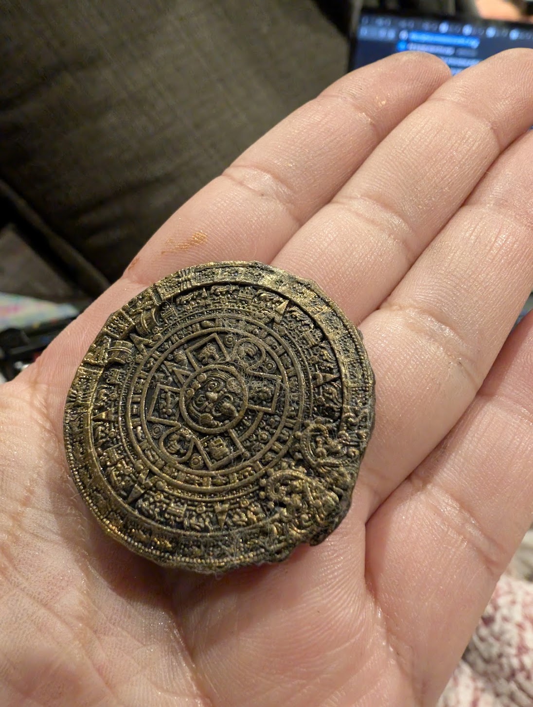 The Sun Stone face of the Arcanium coin